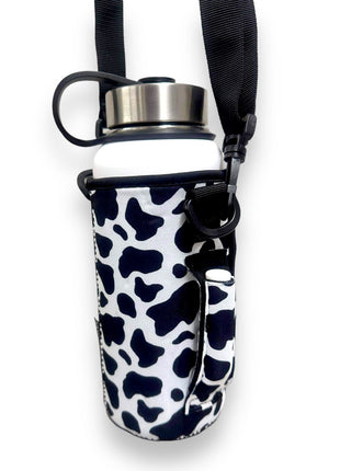 Black and White Cow Print 30-40oz Tumbler Handler™ With Carrying Strap - Drink Handlers